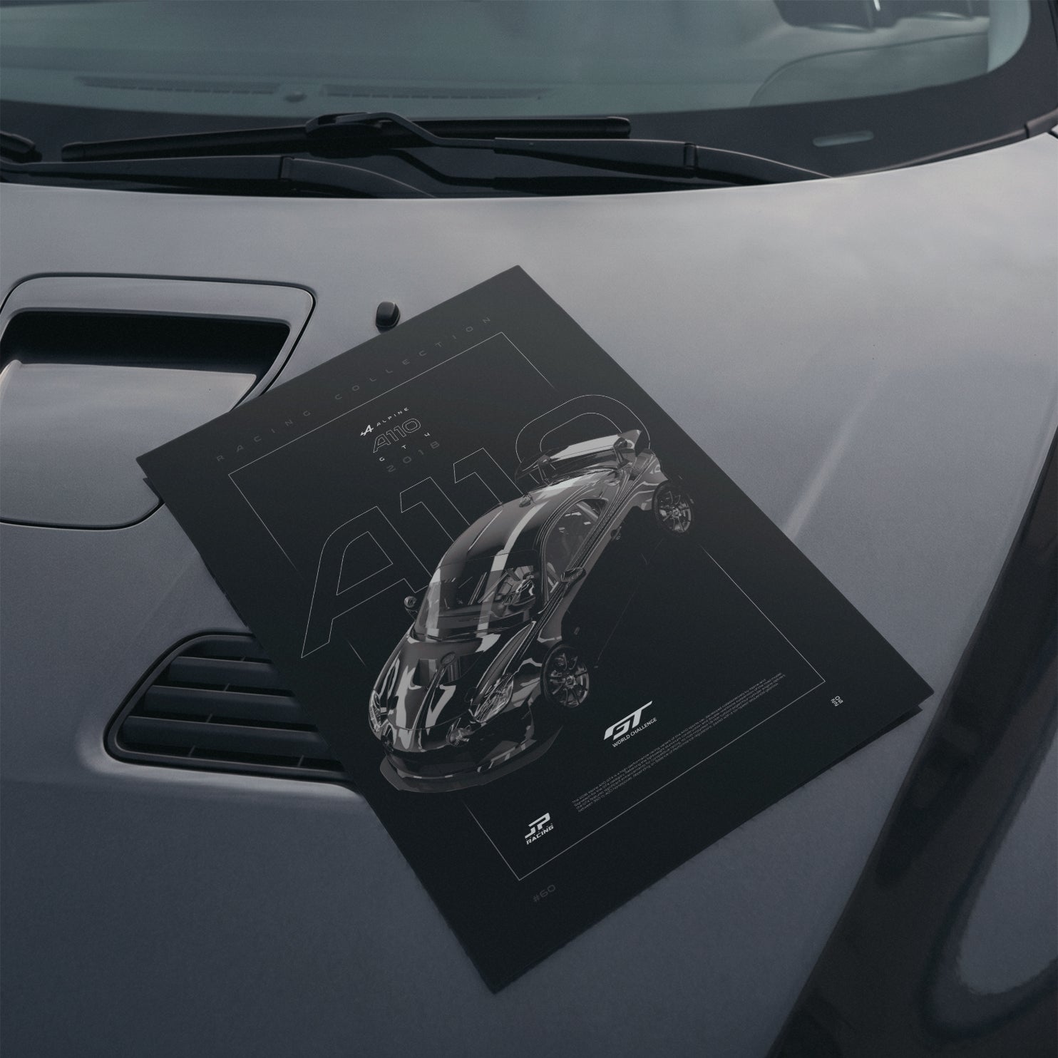 Alpine A110 GT4 2018 poster resting on a car hood