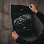 Aston Martin Vantage GT3 2018 poster print held in hands against a concrete wall