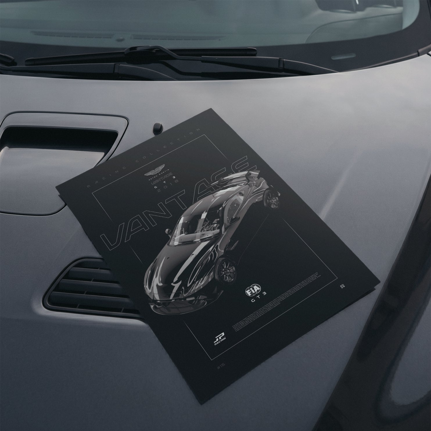 Aston Martin Vantage GT3 2018 poster resting on a car hood