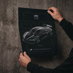 Audi R8 2021 poster print held in hands against a concrete wall