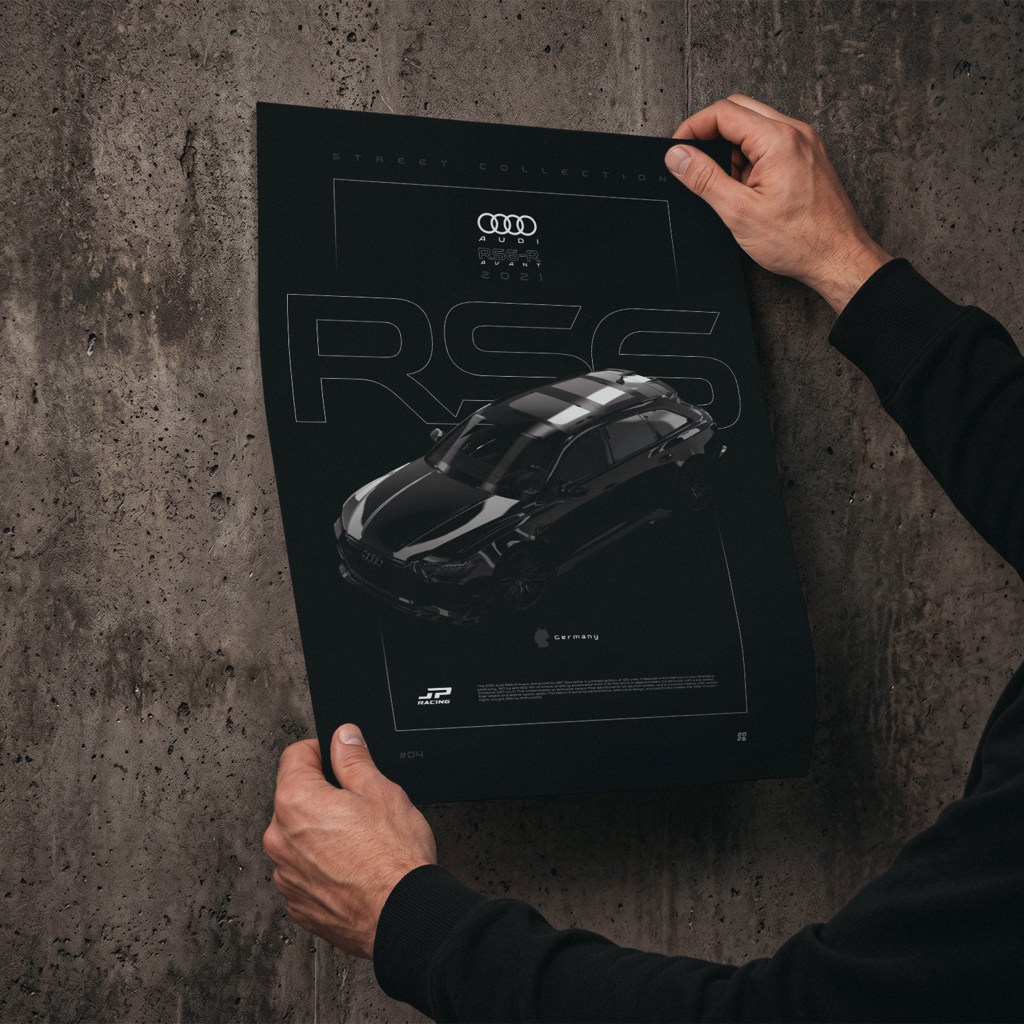 Audi RS6-R Avant 2021 poster print held in hands against a concrete wall