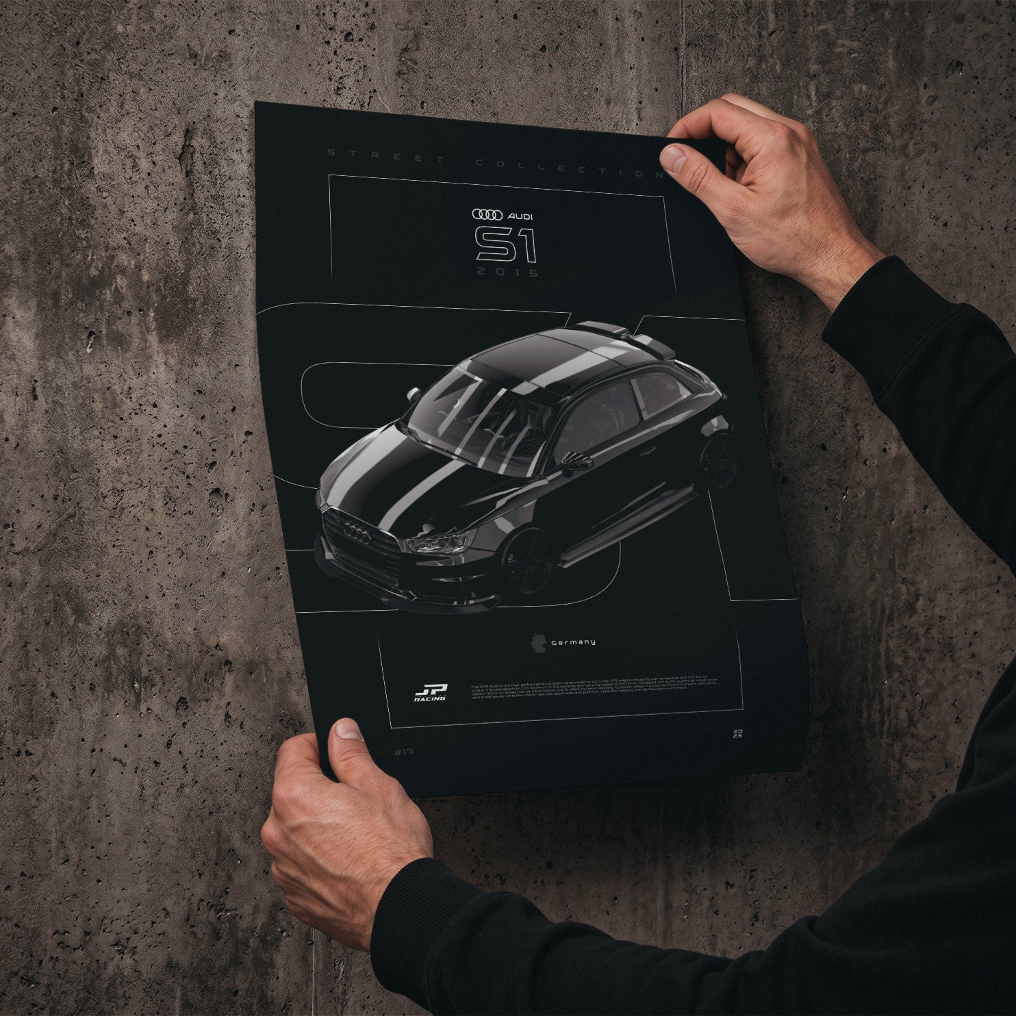Audi S1 2015 poster print held in hands against a concrete wall