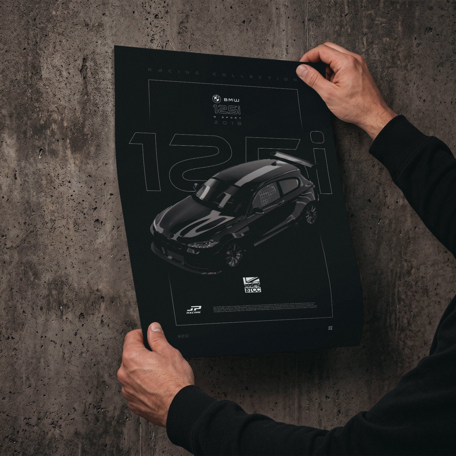 BMW 125i M Sport BTCC 2018 poster print held in hands against a concrete wall