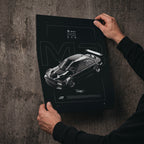 BMW M3 E46 GTR 2004 poster print held in hands against a concrete wall