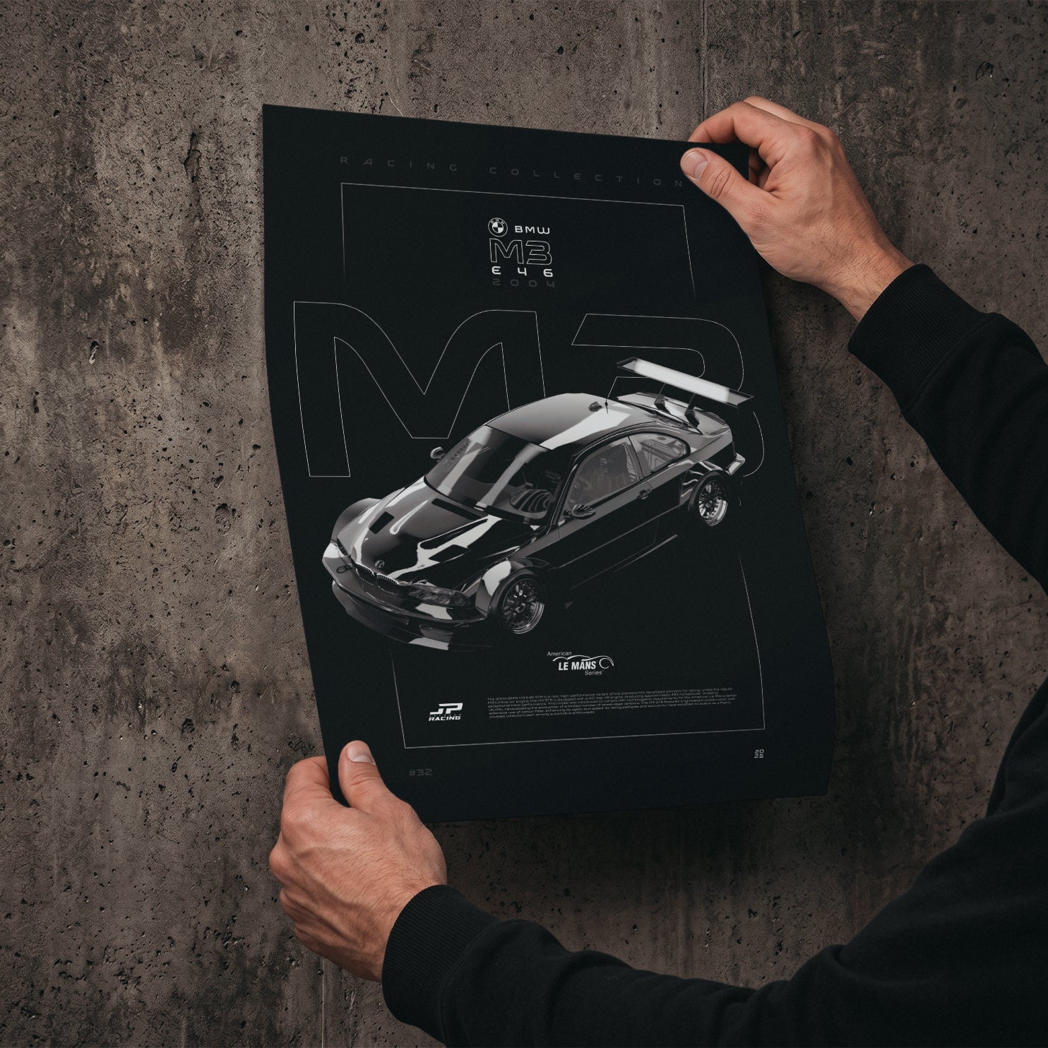 BMW M3 E46 GTR 2004 poster print held in hands against a concrete wall