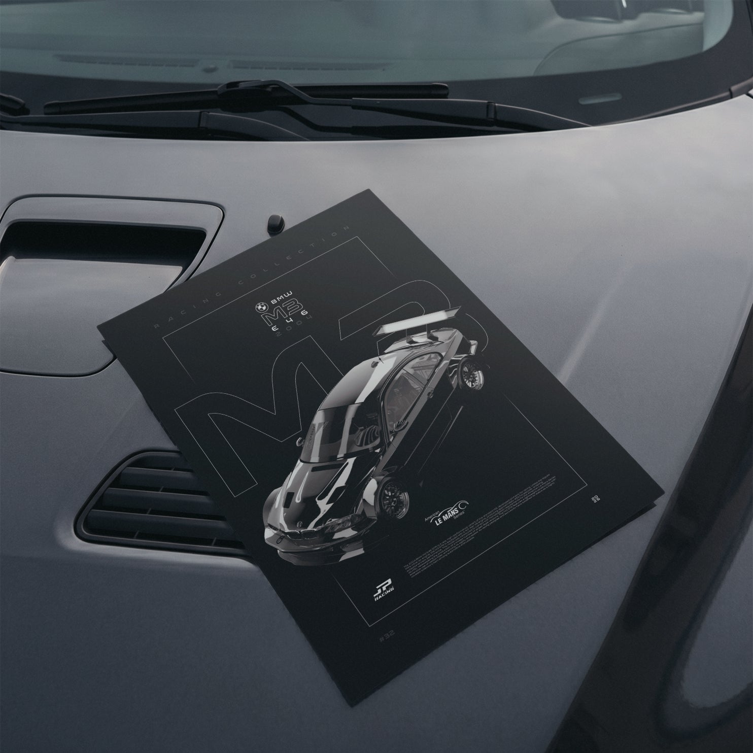 BMW M3 E46 GTR 2004 poster resting on a car hood