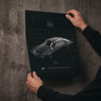 Chevrolet Chevelle SS 1970 poster print held in hands against a concrete wall