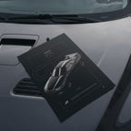 Nissan GTR R34 2000 poster resting on a car hood