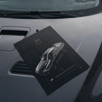 Nissan Skyline GT-R R32 1991 poster resting on a car hood