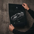 Toyota Supra MKIV FD 1995 poster print held in hands against a concrete wall