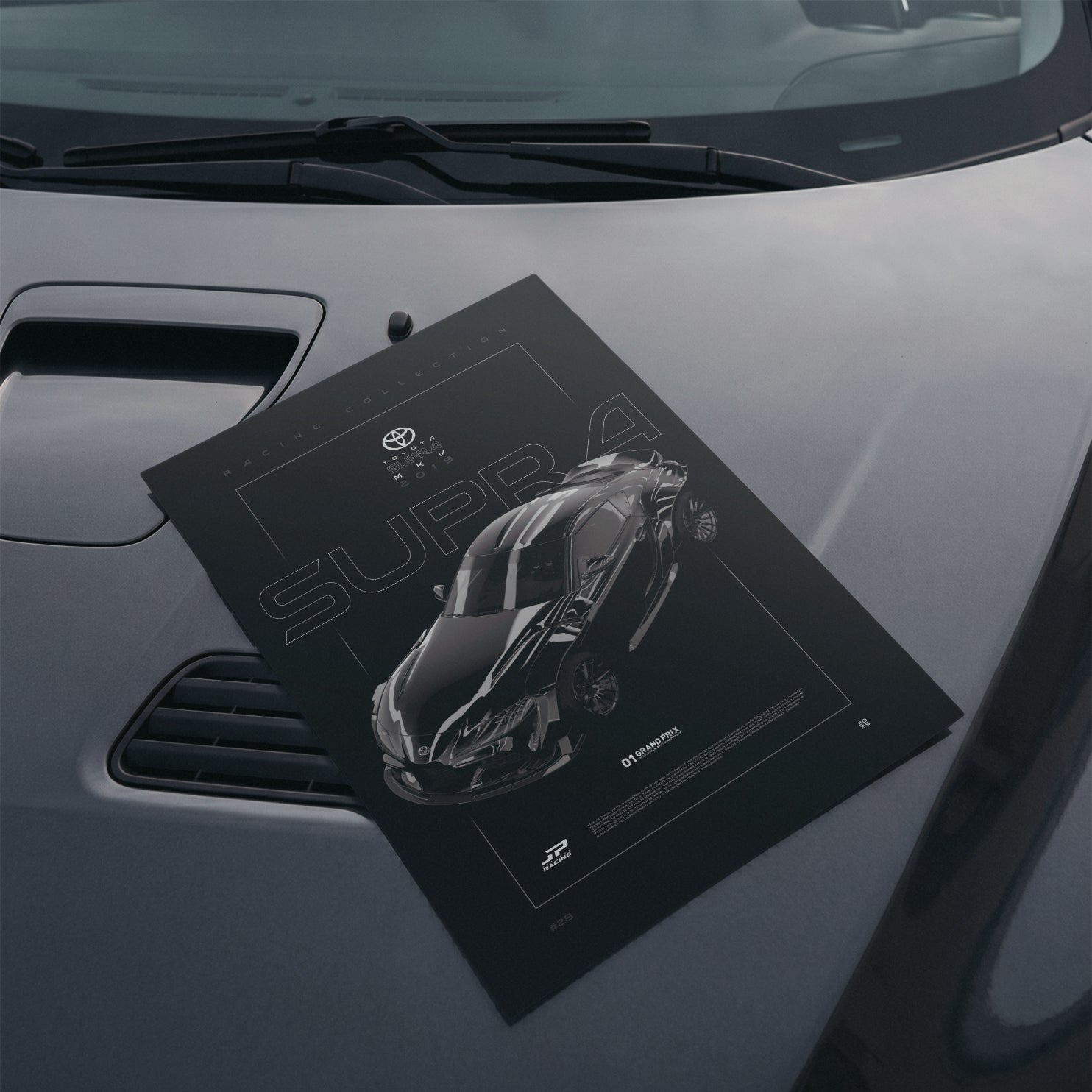 Toyota Supra MKV D1 2019 poster resting on a car hood